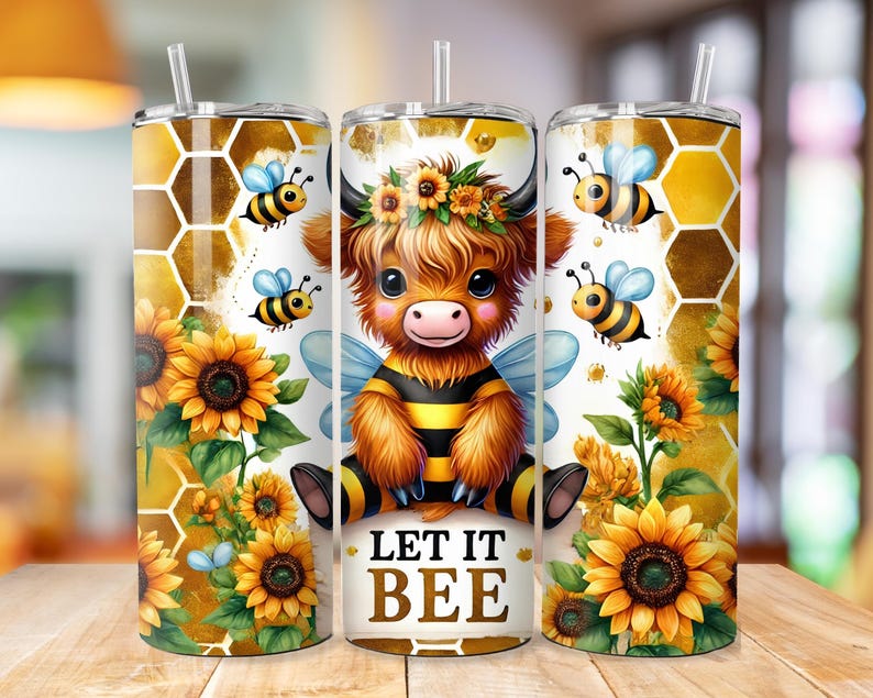 May include: A stainless steel tumbler with a colorful design featuring a cartoon highland cow dressed as a bee. The tumbler has a straw and the design includes sunflowers, bees, and honeycomb. The text "Let it Bee" is printed on the tumbler.
