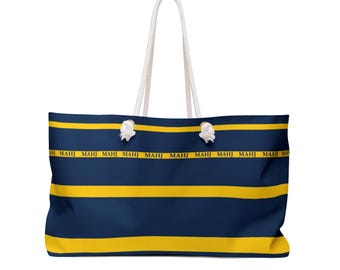 MAHJ Weekender Bag 24" x 13" is handy for toting the whole Mahjong game. It matches our most popular tile storage pouch in navy and yellow.