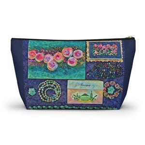 May include: A blue zippered pouch with a collage of images. The images include a bouquet of pink roses, a beaded necklace, a box with the word "Recipes" and a plate of pink flowers.