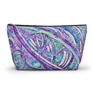 May include: A purple, blue, and green geometric patterned makeup bag with a zipper closure.