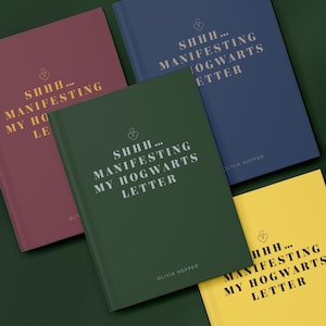 May include: A collection of hardcover journals in various colors: burgundy, navy blue, forest green, and yellow. Each journal features the text "SHHH... MANIFESTING MY HOGWARTS LETTER" in silver lettering, along with the author's name, Olivia Hopper.