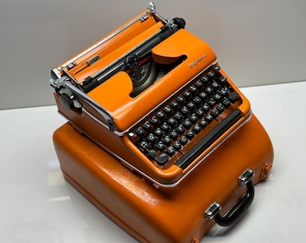 Orange Olympia SM3 Typewriter - QWERTY Keyboard, Fusion of Timeless Aesthetics and Functionality
