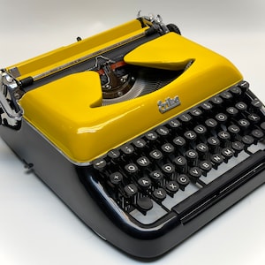 Erika Black Typewriter, 1955 Model with Yellow Cover and Details - Perfect Gift, Case Not Included