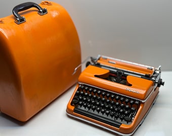Orange Olympia SM3 Typewriter - QWERTY Keyboard, Fusion of Timeless Aesthetics and Functionality