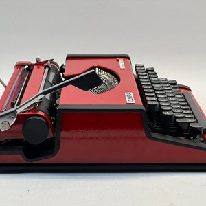 1955 Olympia Traveller Typewriter - Classic Red Design with QWERTZ Layout