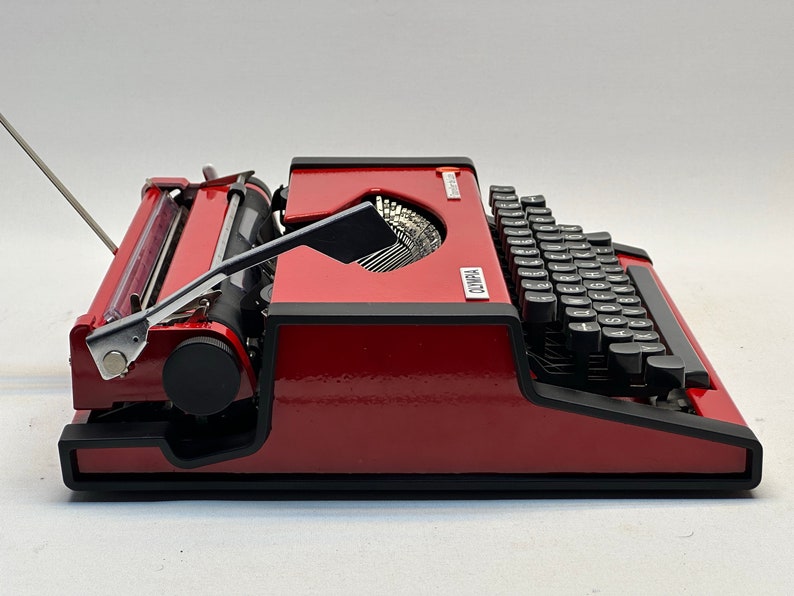 1955 Olympia Traveller Typewriter - Classic Red Design with QWERTZ Layout