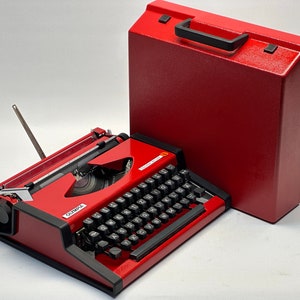 1955 Olympia Traveller Typewriter - Classic Red Design with QWERTZ Layout