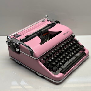 Vintage 1955 Olympia SM3/SM4 Typewriter: Elegant Pink with QWERTZ Layout