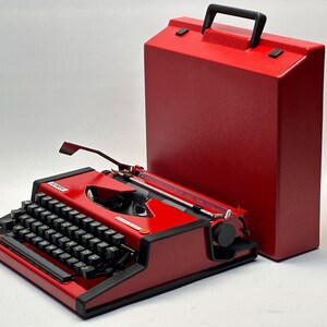 1955 Olympia Traveller Typewriter - Classic Red Design with QWERTZ Layout