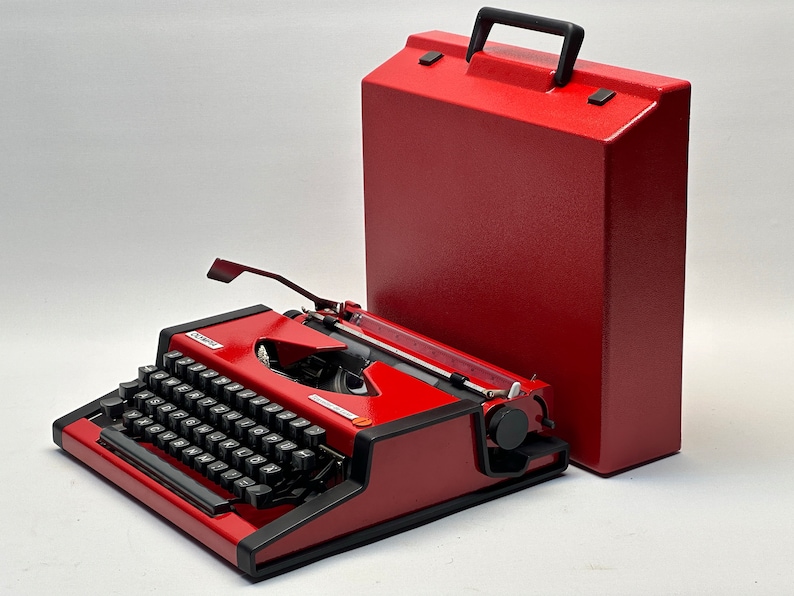 1955 Olympia Traveller Typewriter - Classic Red Design with QWERTZ Layout