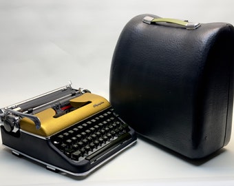 Selten ! 1950er Jahre Olympia SM3 Schreibmaschine - Schwarz mit Goldabdeckung, professionell lackierte, mattschwarze Tasche inklusive - Antike Schreibmaschine