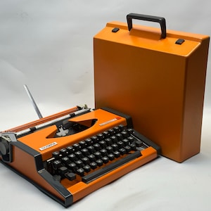 Olympia Orange Typewriter: 1960s QWERTY Model with Matching Bag
