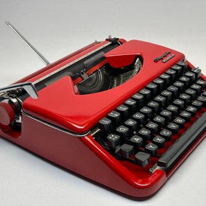 Olympia Splendid 33/66 Typewriter, Red Elegance with Matching Bag and White Keyboard - Vintage Charm from the 1960s