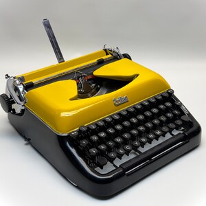 Erika Black Typewriter, 1955 Model with Yellow Cover and Details - Perfect Gift, Case Not Included