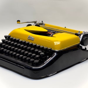 Erika Black Typewriter, 1955 Model with Yellow Cover and Details - Perfect Gift, Case Not Included