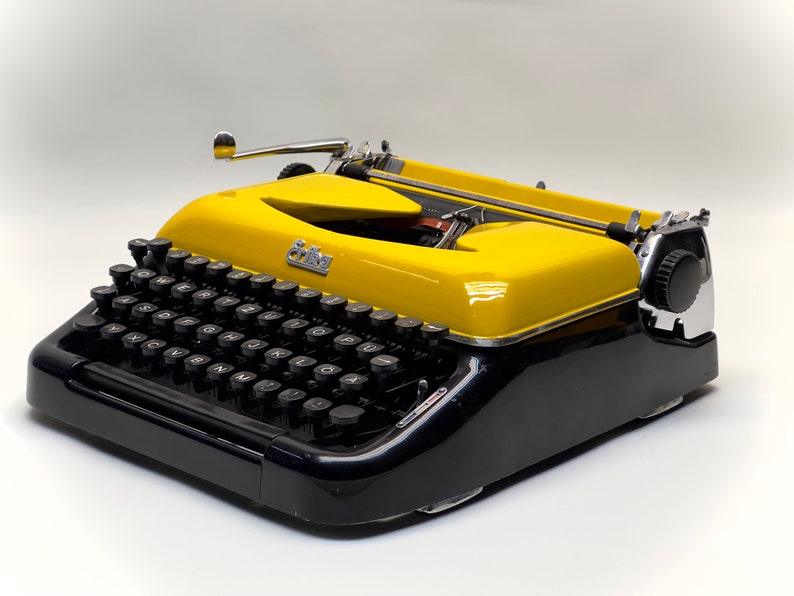 Erika Black Typewriter, 1955 Model with Yellow Cover and Details - Perfect Gift, Case Not Included