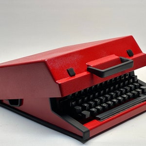 1955 Olympia Traveller Typewriter - Classic Red Design with QWERTZ Layout