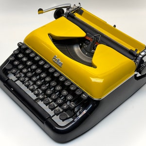 Erika Black Typewriter, 1955 Model with Yellow Cover and Details - Perfect Gift, Case Not Included