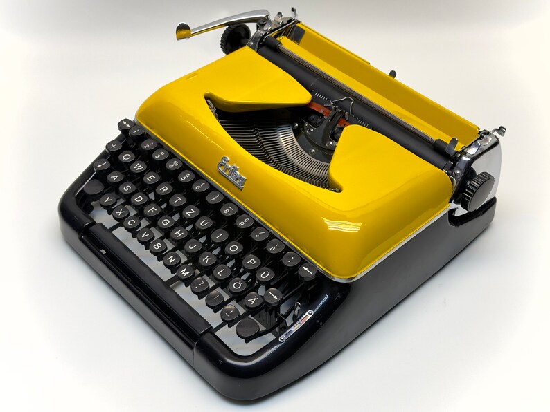 Erika Black Typewriter, 1955 Model with Yellow Cover and Details - Perfect Gift, Case Not Included