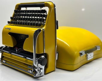 Máquina de escribir Olympia SM3 amarilla con funda amarilla a juego - Teclado QWERTY para una escritura atemporal
