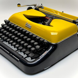 Erika Black Typewriter, 1955 Model with Yellow Cover and Details - Perfect Gift, Case Not Included