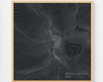 May include: A black and white topographic map print of Mount Thielson, a mountain in Oregon, with the elevation of 9,184 feet printed at the bottom.