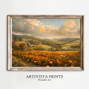 Puede incluir: Una pintura de paisaje enmarcada que representa una escena otoñal vibrante. La obra de arte muestra un campo de calabazas en tonos naranja y amarillo, colinas onduladas y un cielo nublado. El marco es de color marrón claro. El texto "ARTIVISTA PRINTS Printable Art" está en la parte inferior.