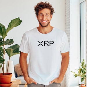 May include: A white t-shirt with a black "XRP" logo printed on the front.