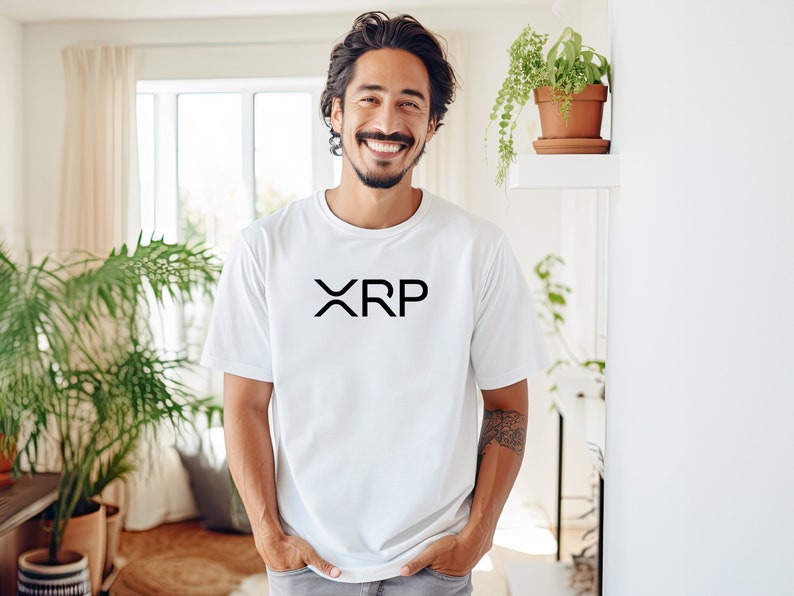 May include: A white t-shirt with a black "XRP" logo printed on the front.