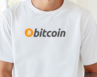 May include: White t-shirt with a black and orange Bitcoin logo and the word "bitcoin" printed on the front.