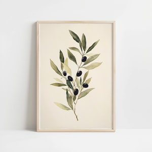 May include: A framed wall art print featuring a watercolor illustration of an olive branch with dark black olives and various shades of green leaves centered on a light cream background, enclosed in a simple light-colored wooden frame.