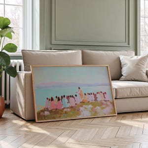 May include: A framed art print depicting a religious scene with figures in pastel colors. The artwork features a central figure in a yellow robe addressing a group of people. The background shows a body of water and a soft, light blue sky.