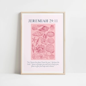 May include: Framed print featuring a collection of detailed seashell illustrations in shades of pink and red on a pink background. The text "JEREMIAH 29:11" is at the top, with a quote below. The frame is a light wood color.