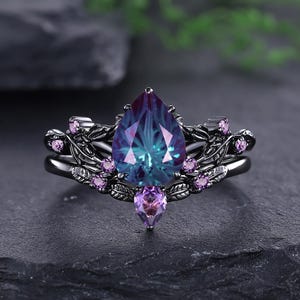 Vigselringar med fyrverkerislipning i alexandrit i svart guld, ametistblad, unika löfteringar för kvinnor, personlig present till henne