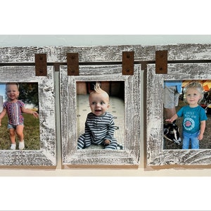 May include: A rustic whitewashed wood picture frame with three openings. Each opening has a photo of a child. The frame has a rustic brown metal accent.