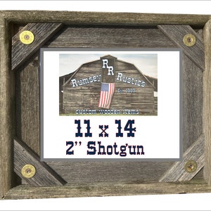 May include: A rustic wooden picture frame with a gray background and four shotgun shell accents. The frame is 11 inches by 14 inches and can hold a 2 inch shotgun shell. The frame is made by Rumsey R Rustics, Est. 1999, and features the text "custom wooden items".