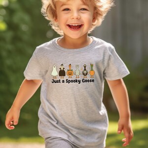 Halloween Spooky Goose Kids shirt, Funny Goose Tshirt, Fall Toddler Sweatshirt, Cute Fall Baby Shower, Cute Goose Baby Onesie®, Ghost Pumpkin Toddler Gift, Boo Halloween Shirt, Spooky Season Tshirt, Retro Halloween Tee, Vintage Halloween, Trick or Treat, Autumn Spooky Vibes, Just a Spooky Goose Funny Toddler T-Shirt