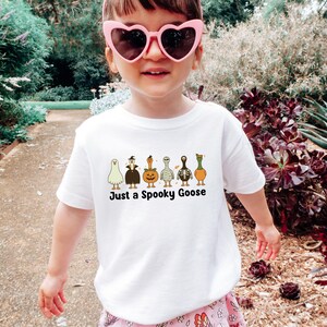 Halloween Spooky Goose Girl shirt, Funny Goose Tshirt, Fall Toddler Sweatshirt, Cute Fall Baby Shower, Cute Goose Baby Onesie®, Ghost Pumpkin Toddler Gift, Boo Halloween Shirt, Spooky Season Tshirt, Retro Halloween Tee, Vintage Halloween, Trick or Treat, Autumn Spooky Vibes, Just a Spooky Goose Funny Toddler T-Shirt