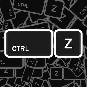 May include: A close-up of a computer keyboard with the keys "CTRL" and "Z" highlighted. The keys are black with white lettering and are surrounded by other keys.