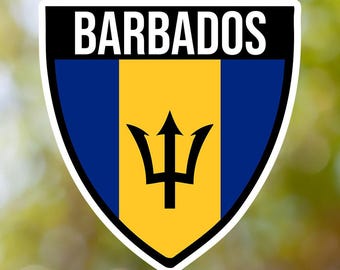 May include: A shield-shaped sticker with the word "BARBADOS" in black text on a white background. The shield features the flag of Barbados, with a yellow field and a blue vertical stripe on each side. A black trident is centered on the yellow field.