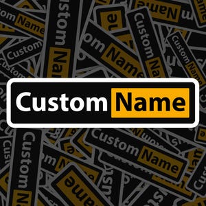 May include: A close-up of a black and yellow sticker with the text "Custom Name" repeated multiple times. The sticker is a rectangular shape with rounded corners and a white border.