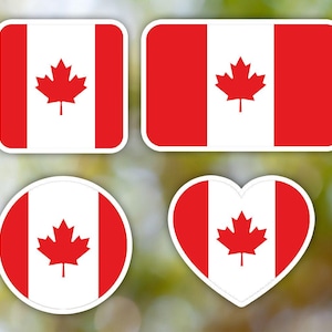May include: Four different shapes of stickers featuring the Canadian flag. The flag is red and white with a red maple leaf in the center. The stickers are in the shapes of a square, rectangle, circle, and heart.