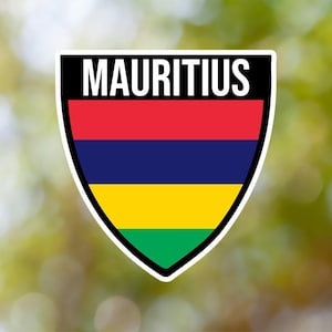 May include: A shield-shaped sticker with the word "MAURITIUS" in white letters on a black background. The shield is divided into four horizontal stripes: red, blue, yellow, and green.