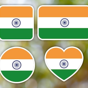 May include: Four different shapes of stickers with the Indian flag. The flag is a tricolour of saffron, white and green with a blue wheel in the center.