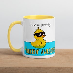 Cute cartoon duck mug: “life is pretty ducking awesome” white and yellow ceramic mug