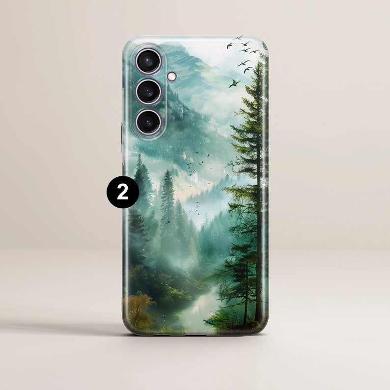 May include: A phone case with a misty forest scene featuring tall trees and a river. The case has a clear background and a camera cutout.
