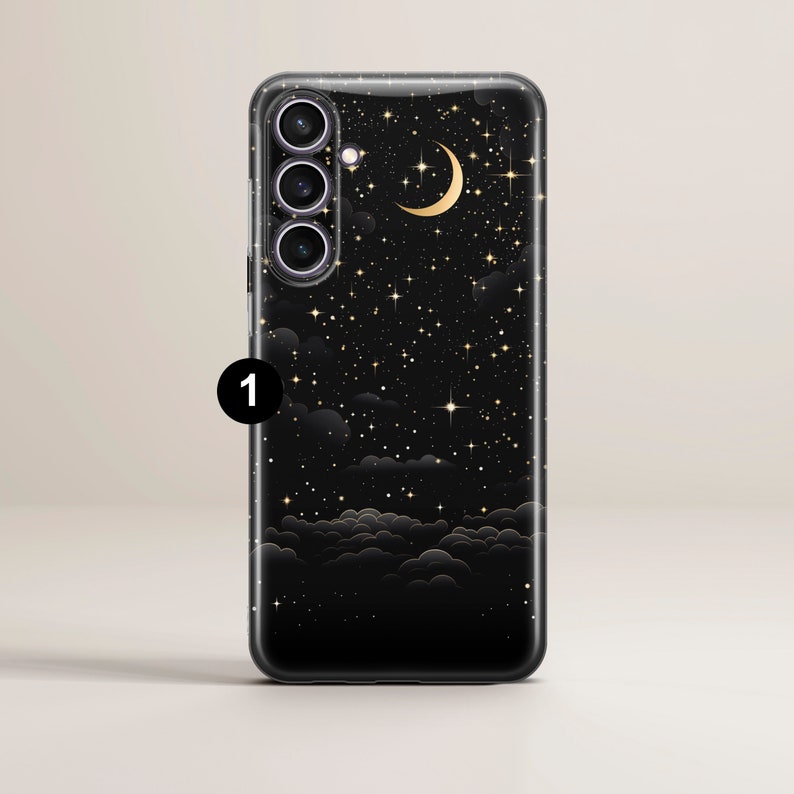May include: A black phone case with a starry night design. The case features a crescent moon and gold stars on a black background with clouds.