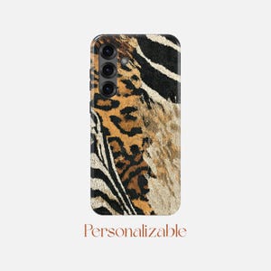 May include: A phone case with a mixed animal print design. The case features leopard spots, zebra stripes, and a textured pattern in brown, black, and tan. The word "Personalizable" is printed at the bottom.