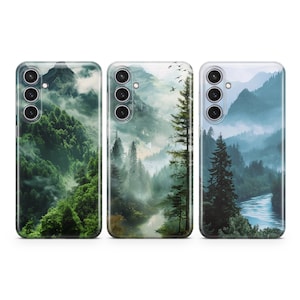 May include: Three phone cases with a misty forest scene. The cases are clear and show a green forest with a river and mountains in the background.