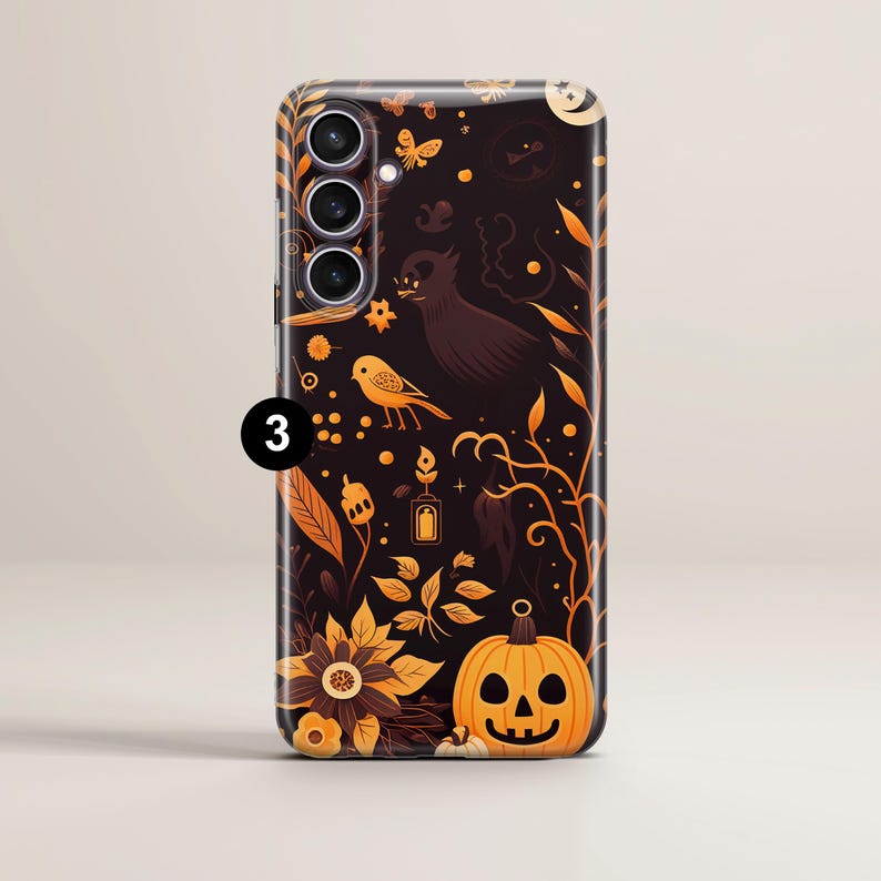 May include: A black phone case with a Halloween-themed design. The case features a black background with orange and yellow accents. The design includes pumpkins, birds, leaves, and a ghost. The case has a camera cutout and a raised lip around the edges.